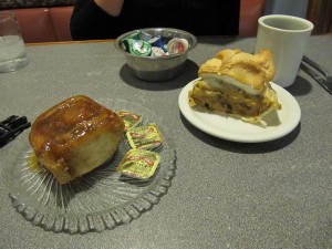 Pie and sticky roll on diner table